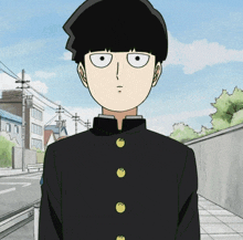 a boy in a black suit with yellow buttons