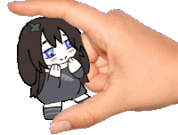 a hand is holding a drawing of a girl with long hair