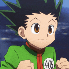 a boy in a green shirt with the number 405 on his chest