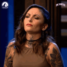 a woman with a tattoo on her neck is a contestant on the ink master show