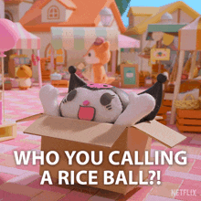 a cardboard box with a stuffed animal in it and the words " who you calling a rice ball "