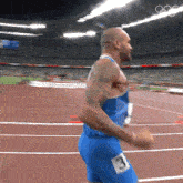 a man in blue shorts with the number 3 on his shorts