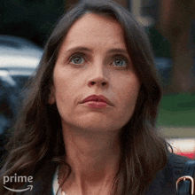 a close up of a woman 's face with the word prime on the bottom