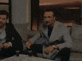 two men sitting on a couch with the words i 'm scared of crazy people