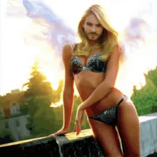 a woman in a bikini with a man 's face on it