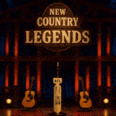 a stage with two guitars and a sign that says " new country legends the big show "