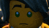 a close up of a lego character with a serious look on his face