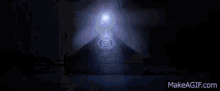 a dark room with a light coming out of the corner .