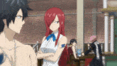 a girl with red hair is standing next to a man with gray hair