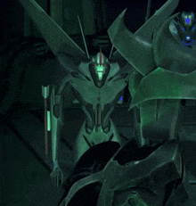 a close up of a green robot with glowing eyes