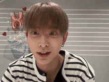 a close up of a person 's face with a balloon in the background that says happun