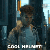 a man in a plaid shirt says cool helmet