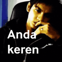 a blurry picture of a person with the words anda keren written below it