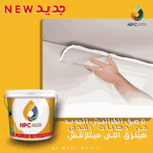a bucket of npc al nada paints is being used to paint a wall