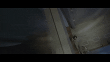 a dark room with a lot of smoke coming out of the ceiling