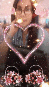 a woman with glasses is surrounded by flowers and a heart shaped frame