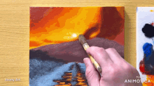 a person is painting a sunset on a canvas with a brush and the words made in animatica on the bottom