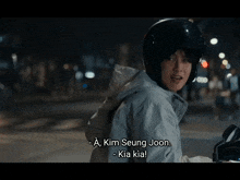 a woman wearing a helmet says a kim seung joon