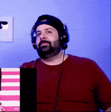 a man with a beard is wearing headphones