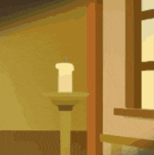 a candle sits on a pedestal next to a window