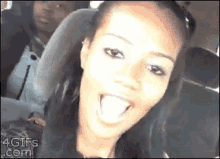 a woman sitting in a car with her tongue hanging out and the website 4gifs.com is visible in the corner