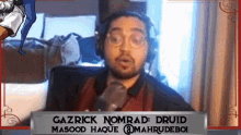 gazrick nomrad ' druid masood haque @mahrudeboi is talking into a microphone