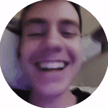 a close up of a man 's face in a circle