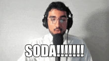 a man wearing headphones and glasses says soda