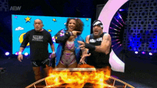 a group of wrestlers are standing next to each other and one has a shirt that says stone pitbull