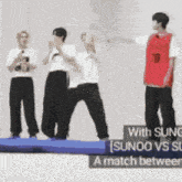 a group of people are standing on a blue mat with the words sunoo vs sg written on it