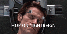 a man is laying in a chair with the words hop on nightreign written above him