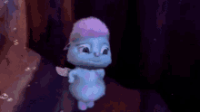 a baby is being held by a person in a dark room and is flying in the air .