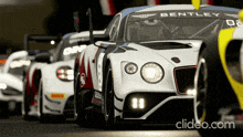 a bentley race car is in a row of other race cars