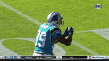 a football player with the number 19 on his jersey catches a pass