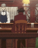 a man in a red coat sits at a table in front of a bartender