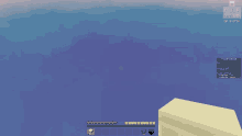 a screenshot of a minecraft game shows a large brick structure in the middle of the ocean