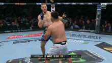 two men are fighting in a boxing ring and one of them is wearing shorts that say gastlum