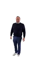 a man wearing a blue sweater and blue pants is giving an ok sign