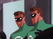 two green lanterns standing next to each other in front of a mirror