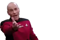 a man in a star trek uniform is pointing at something