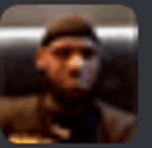 a blurry picture of a man in a hat