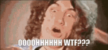 a close up of a man 's face with his mouth open and the words ooohhhh wtf ?