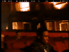 a blurry picture of a man in a theater