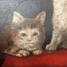 a painting of two cats sitting on a red couch .