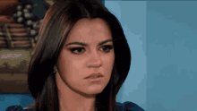a woman with a serious look on her face