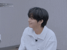 two young men are sitting next to each other in front of a screen that says ' song matching vote '