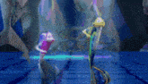 a group of dolphins are dancing in a swimming pool .