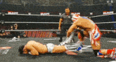 two wrestlers in a wrestling ring with raw written on the wall