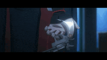 a man is standing in a dark room with a light shining through the door