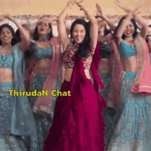 a group of women are dancing with their arms in the air and the words thirudan chat are on the bottom